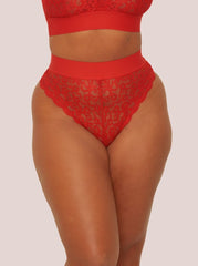 Red lace lingerie set on a plain background